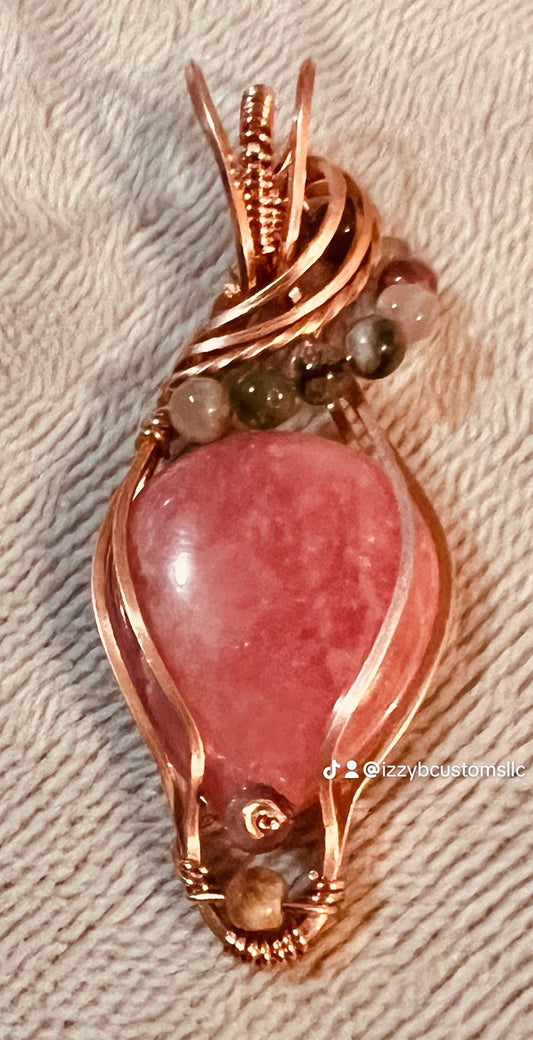 Rhodochrosite wrapped in copper